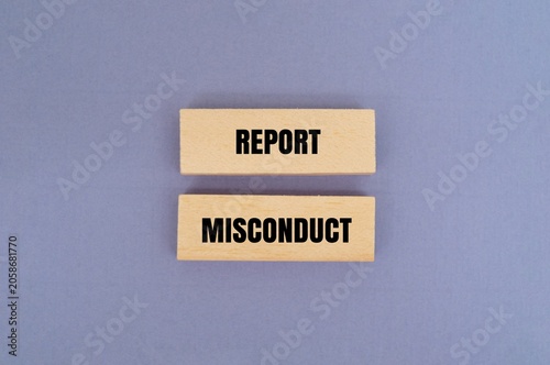 Canvastavla A wooden blocks with text REPORT MISCONDUCT