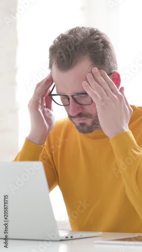 Man having Headache while Working on Laptop, Vertical Video