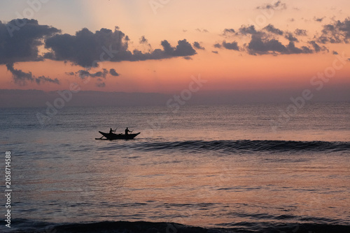 Fishermen silhouetted against Sri Lanka sunset