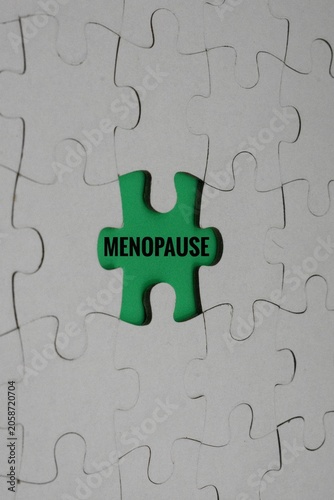 A green jigsaw puzzle piece with the word 