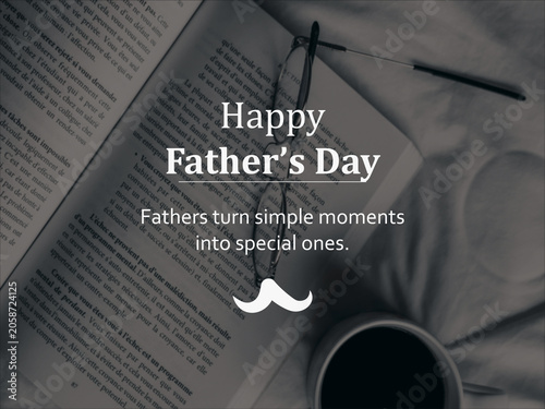 Moody overhead view of an open book, glasses, and coffee cup with Happy Father's Day text overlay