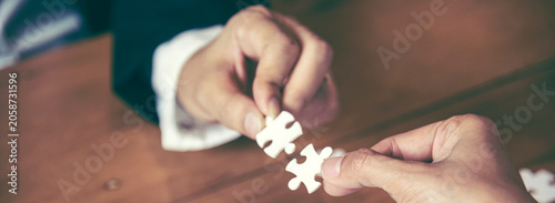 Banner Implement puzzle improve communication solve synergy team connection plan trust strategy. Piece of jigsaw assembly with copy space. Banner Business connections strategy synergy team solution