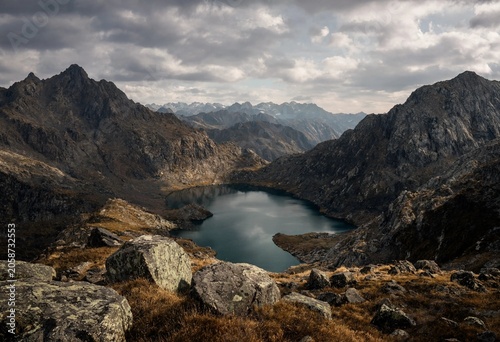 Canvas Print mountain lake surrounded by rugged rocky peaks in the Scottish Highlands, a cine