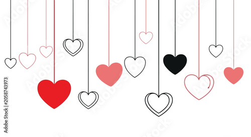 Romantic background featuring various red black and white heart shapes hanging on thin strings for love concept.
