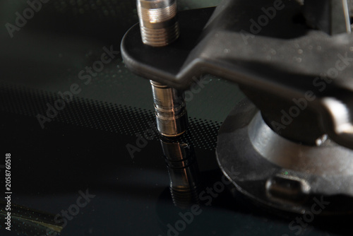 Repair of chips and cracks on car windows. Repair of windshields