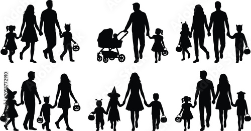 Foto Halloween families trick or treating together
