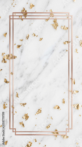 Elegant rectangular rose gold frame mockup on luxury white marble background with scattered gold leaf flakes