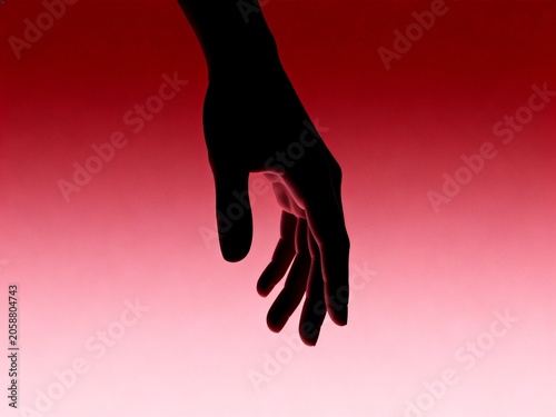 Silhouette of a Hand Against Red Gradient