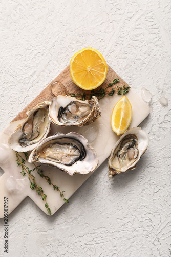 Fresh raw oysters on marble...