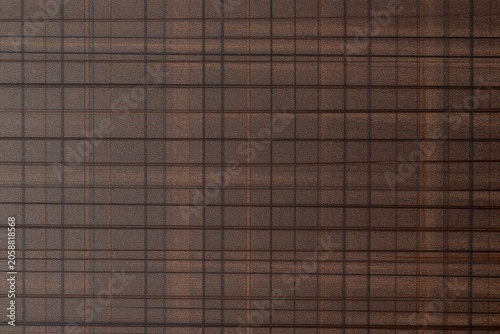 a close up of a wooden surface with a black background