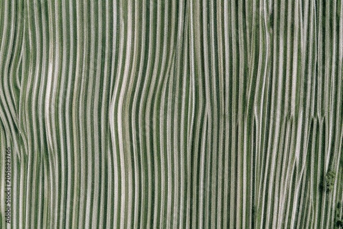 A close up of a green and white marble surface