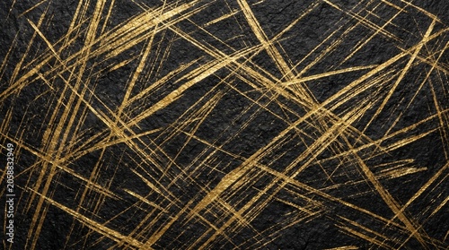 Abstract background featuring golden scratches on a dark textured black surface.