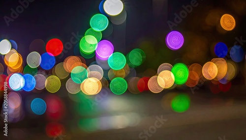 Abstract Bokeh Lights Cityscape at Night with Colorful Reflections.