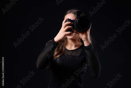 Female photographer with mo...