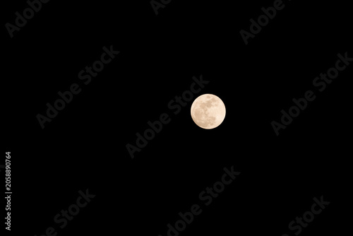 Fotografie Full moon glowing softly against night sky