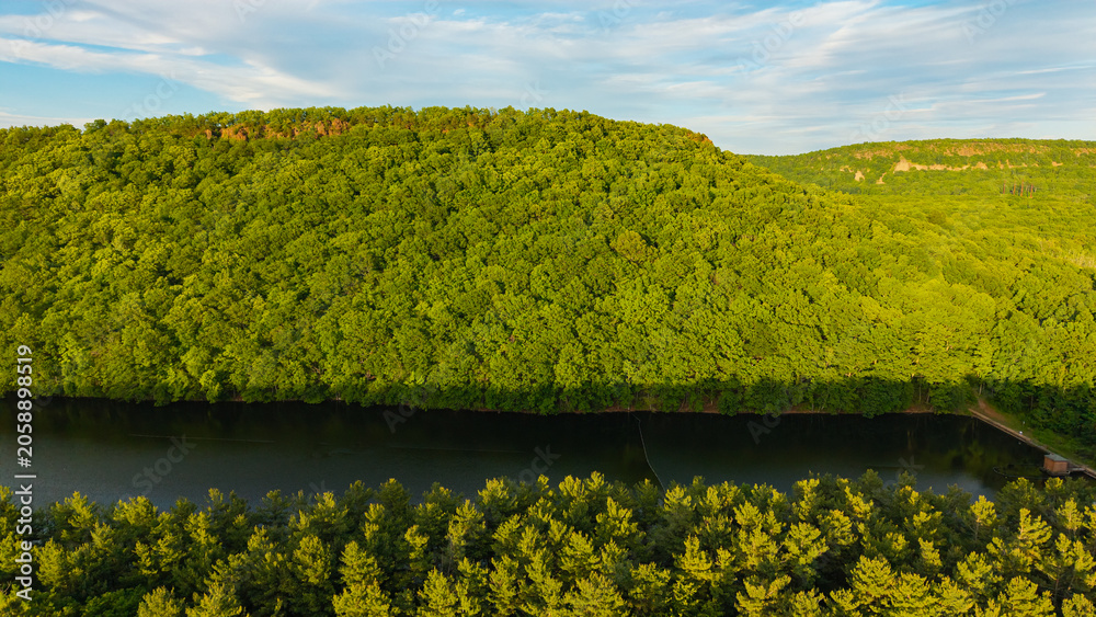 Fototapeta premium Summer aerial view featuring the Bradley Hubbard Reservoir at Doctor Francis Giuffrida Park and Chauncey Peak in Meriden, Connecticut