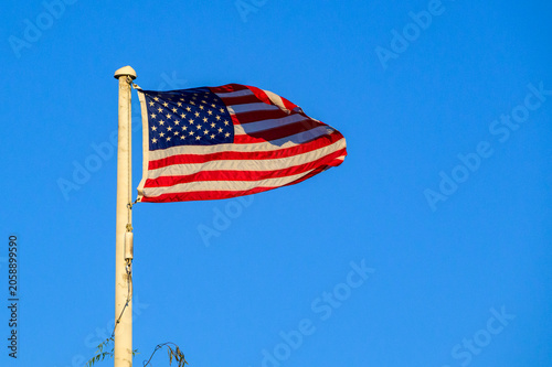 A classic American flag flying against a clear blue sky. Virginia, USA