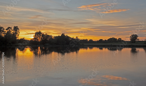 Beautiful late springtime sunset over water at Marston, Northwich, Cheshire, UK