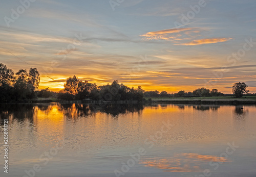 Beautiful late springtime sunset over water at Marston, Northwich, Cheshire, UK