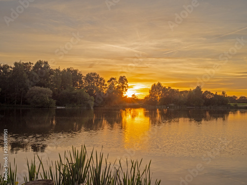 Beautiful late springtime sunset over water at Marston, Northwich, Cheshire, UK