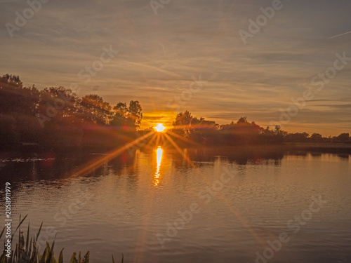 Beautiful late springtime sunset over water at Marston, Northwich, Cheshire, UK