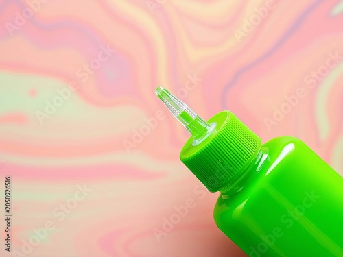Vibrant green squeeze bottle with dispensing tip for liquid adhesive or craft supplies, crafting tool, DIY project