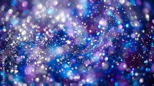  Abstract blue and purple glitter bokeh background with shimmering lights