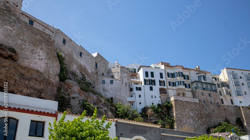 White buildings on a hill overlooking the sea in Mahon, Menorca, , Spain