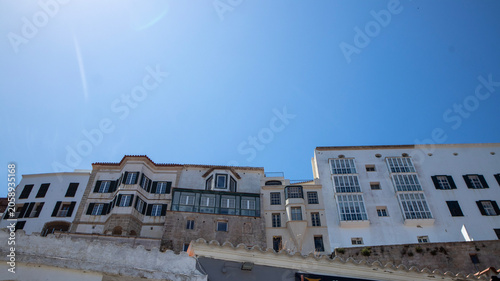 White buildings on a hill overlooking the sea in Mahon, Menorca, , Spain