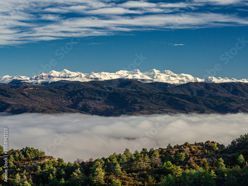 Quadro su tela Pyrenees mountains with snow and a sea of clouds