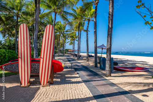 Luxury Tropical Beach with Surfboards and Palm Trees in Nusa Dua, Bali, Indonesia