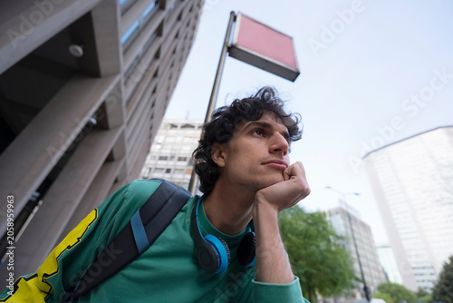 Gen Z traveler thinks while waiting for metro in Italy