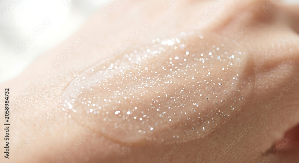 Fototapeta premium Macro photography of clear gel serum texture with micro bubbles smeared on human skin for hydration organic cosmetic product advertising.