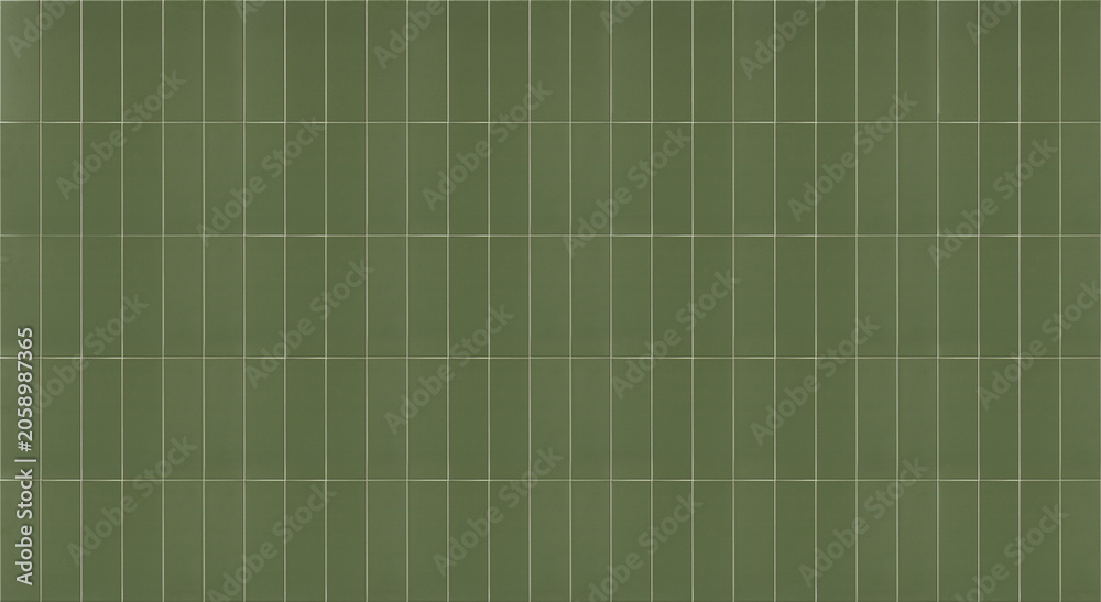 Fototapeta premium Panoramic view of modern green ceramic wall tiles arranged in a vertical rectangular block grid pattern for interior design.