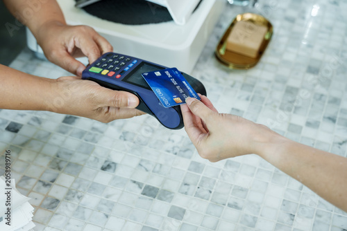 Canvastavla Coffee shop counter scene showing credit card approaching terminal for payment,