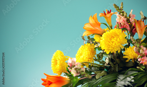 Beautiful floristic bouquet, bright lily flower art design, professional bouquet with different flowers, close up. Colorful Chrysanthemums and other flowers, collected in beautiful floral arrangement
