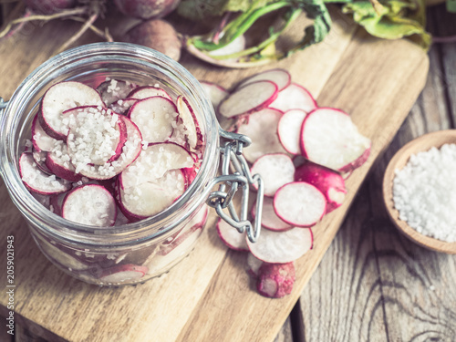 Traditional homemade pickled radishes in rustic kitchen