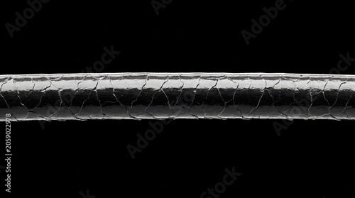 Macro of dark hair strand with protective protein film