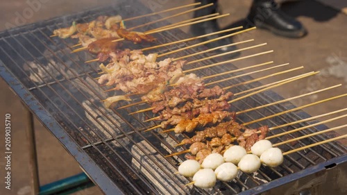 Grilled Meat Skewers and Quail Eggs on a Charcoal Barbecue Grill