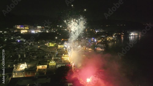 Fireworks Over Waterfront Town at Night