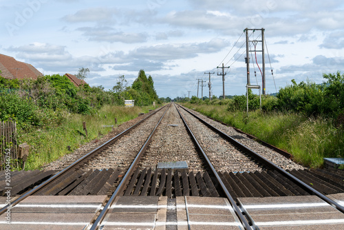 Railway tracks of the Birmingham to Bristol main line stretching into the distance near Ashchurch, Tewkesbury, Gloucestershire, England