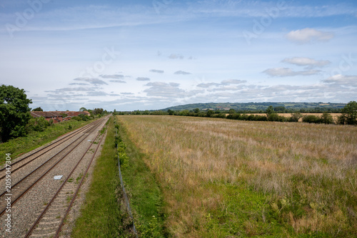 Double-track railway main line running straight through countryside near Ashchurch, Tewkesbury, Gloucestershire