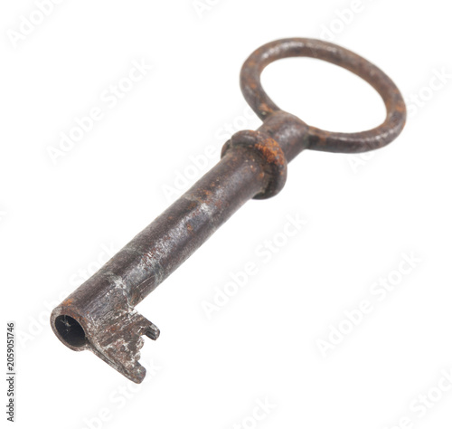 Old rusty key isolated on white background.