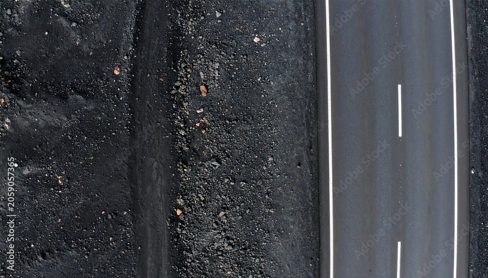 Fototapeta premium Rough dark asphalt road texture with white edge marking line