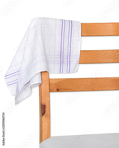 A classic white cotton handkerchief with a purple striped plaid pattern draped elegantly over the back of a wooden chair.
