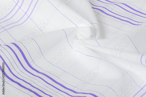 A detailed close-up of a soft white cotton handkerchief, elegantly crumpled to showcase its texture and clean purple striped pattern.