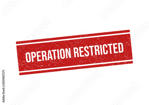 Red rubber stamp with the text operation restricted in a grunge style