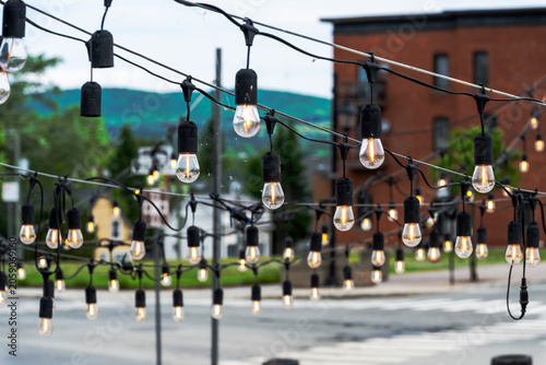 Light bulbs over a park terrace
