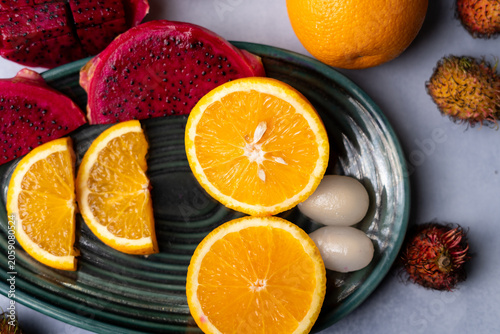 Fresh Dragon Fruit and Orange Slices on Decorative Plate