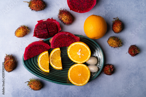 Fresh Dragon Fruit and Orange Slices on Decorative Plate